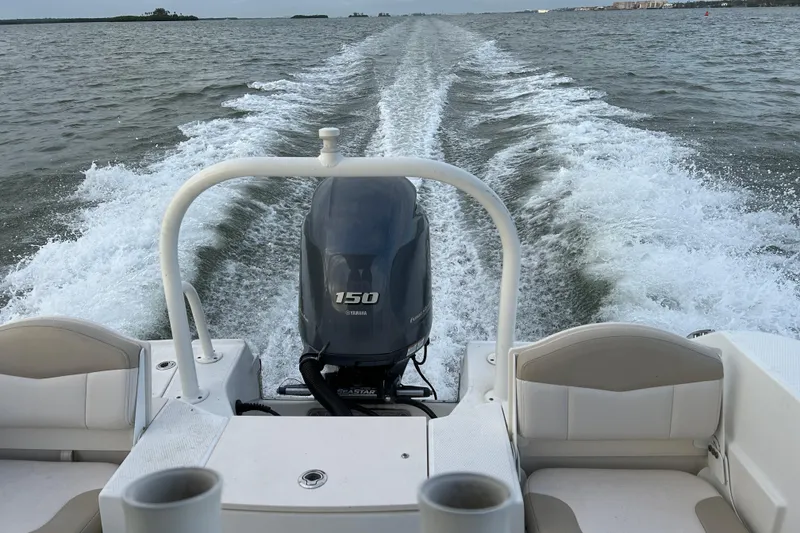 Slide: The Image of 2016 Robalo R200 Center Console boat with Yamaha 150 engine on open water. - 19