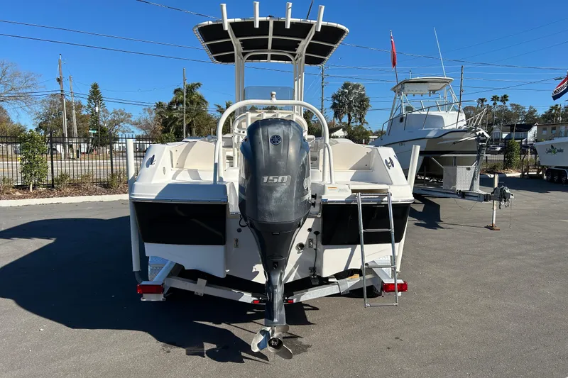 Slide: The Image of 2016 Robalo R200 Center Console boat with Yamaha 150 engine, parked outdoors. - 3