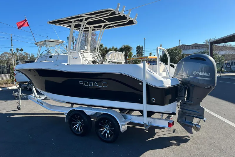 Slide: The Image of 2016 Robalo R200 Center Console boat on trailer with Yamaha outboard motor. - 4