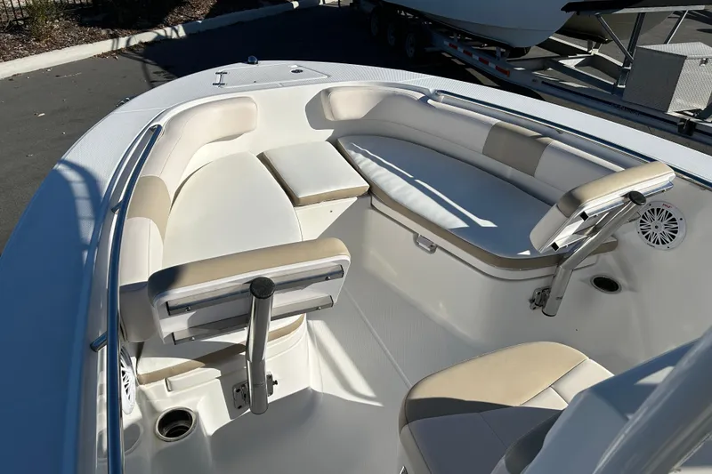 Slide: The Image of 2016 Robalo R200 Center Console boat interior with cushioned seating and cup holders. - 8