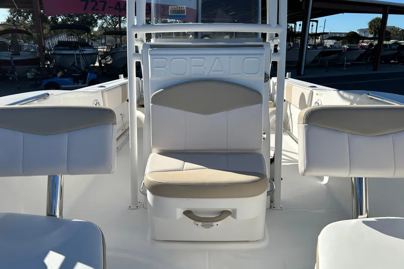 Slide: The Image of 2016 Robalo R200 Center Console boat interior with cushioned seating and console. - 9