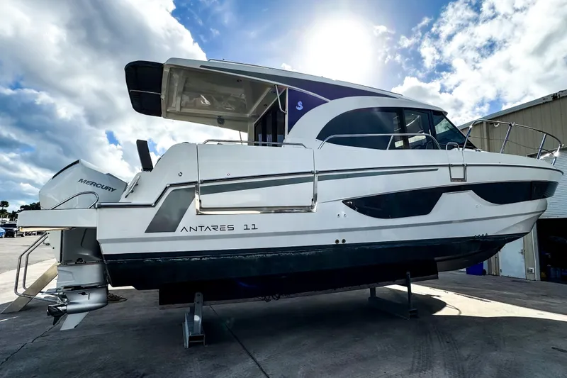 The Image of 2024 Beneteau America Antares 11 boat on display under a cloudy sky. - 0