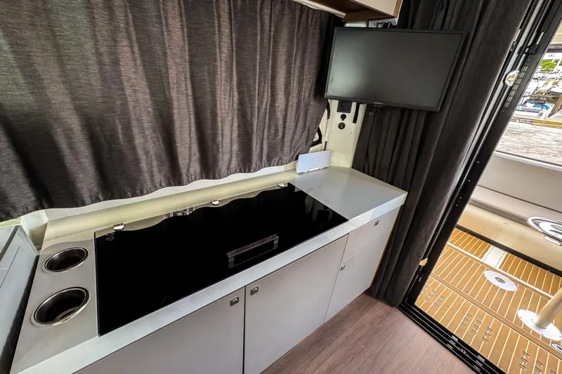 Slide: The Image of 2024 Beneteau Antares 11 interior kitchen with modern appliances and sleek design. - 17