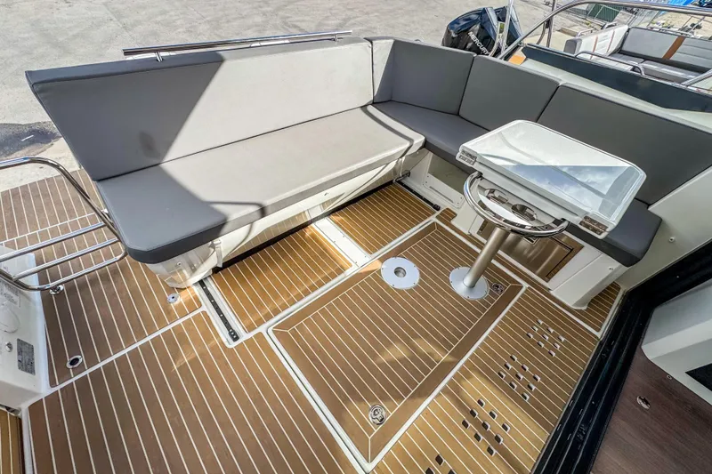 Slide: The Image of 2024 Beneteau Antares 11 boat interior with sleek seating and modern design. - 3