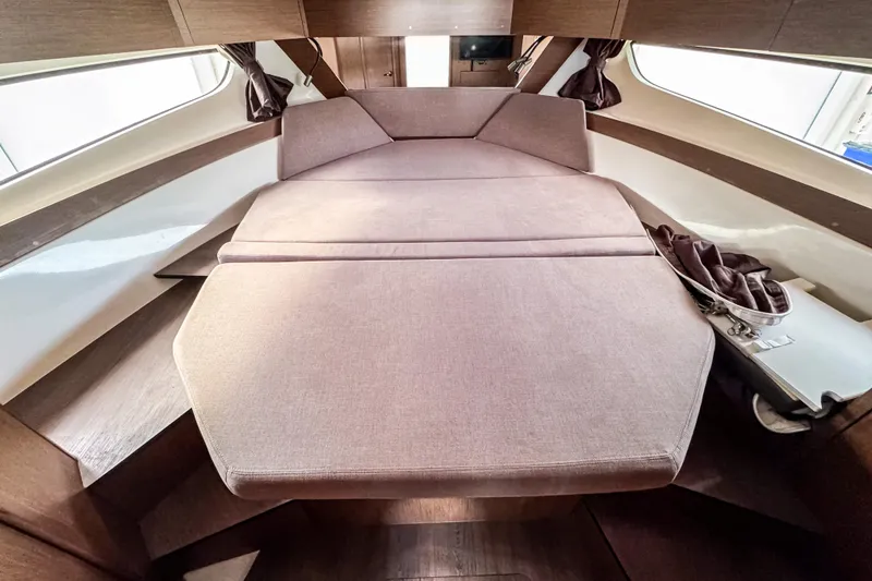 Slide: The Image of 2024 Beneteau Antares 11 interior cabin with comfortable bed and modern design. - 35