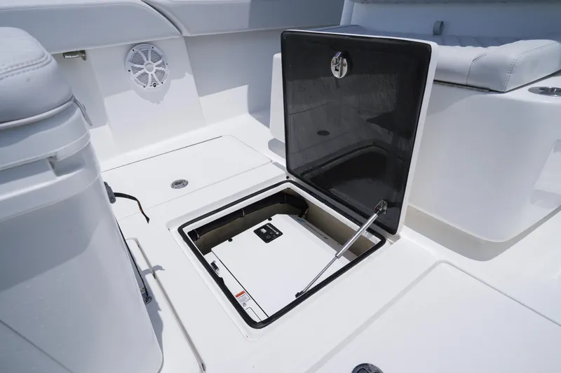 Slide: The Image of 2023 SeaHunter 31 Tournament boat storage compartment open on deck. - 10