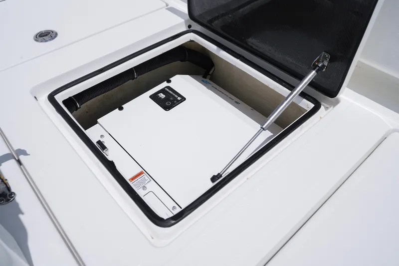 Slide: The Image of Open storage compartment on 2023 SeaHunter 31 Tournament boat. - 11