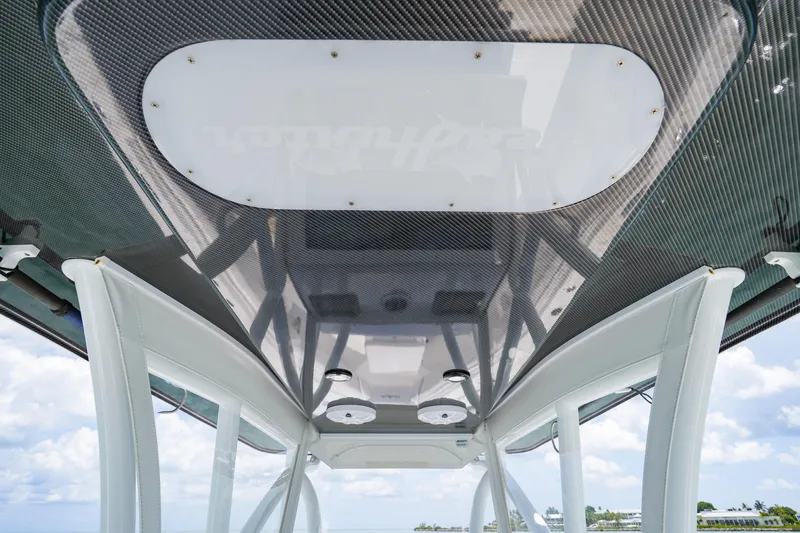 Slide: The Image of 2023 SeaHunter 31 Tournament boat's sleek carbon fiber T-top design. - 14