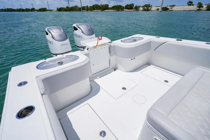 Slide: The Image of 2023 SeaHunter 31 Tournament boat with Suzuki engines on calm water. - 18