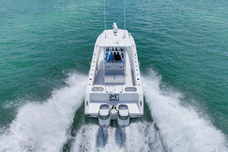 Slide: The Image of 2023 SeaHunter 31 Tournament boat cruising on clear blue water. - 5