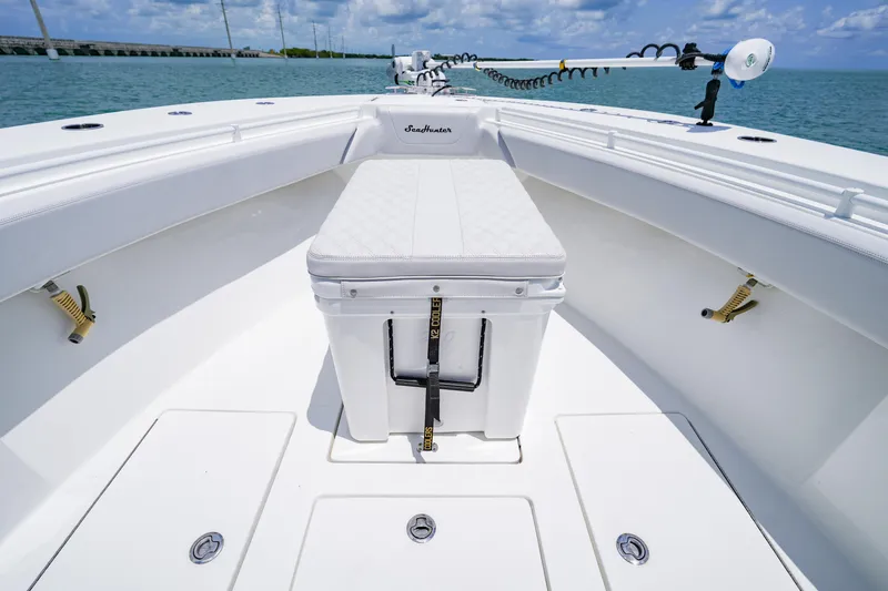 Slide: The Image of 2023 SeaHunter 31 Tournament boat deck with seating and storage, ocean view. - 9