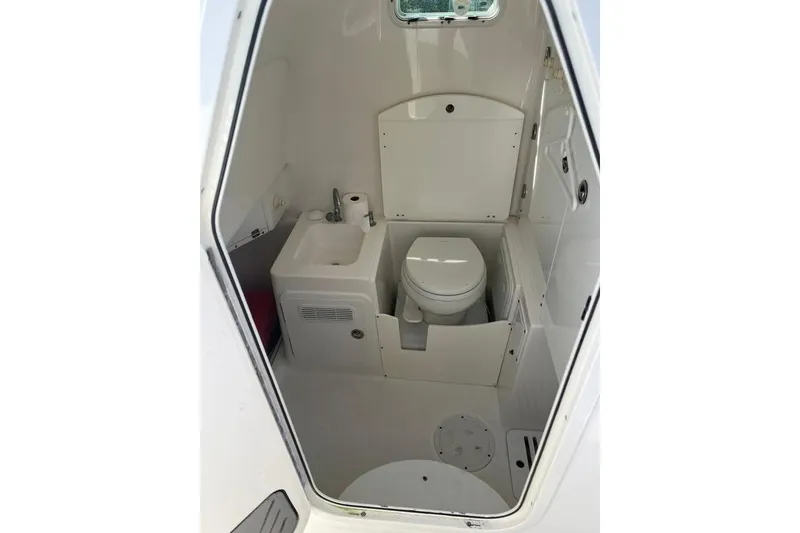 Slide: The Image of 2008 Everglades 350 Center Console boat interior with toilet and sink. - 10