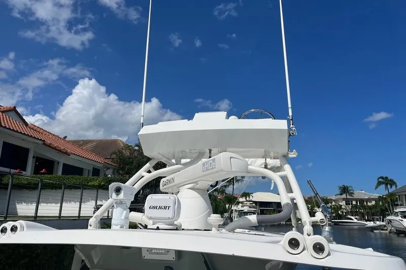 Slide: The Image of 2008 Everglades 350 Center Console boat with Garmin and Golight equipment, docked under blue sky. - 9