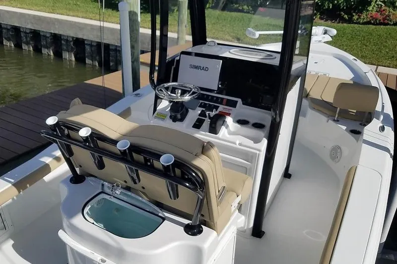 Slide: The Image of 2019 Sea Hunt BX 25 FS boat interior with Simrad navigation system. - 2
