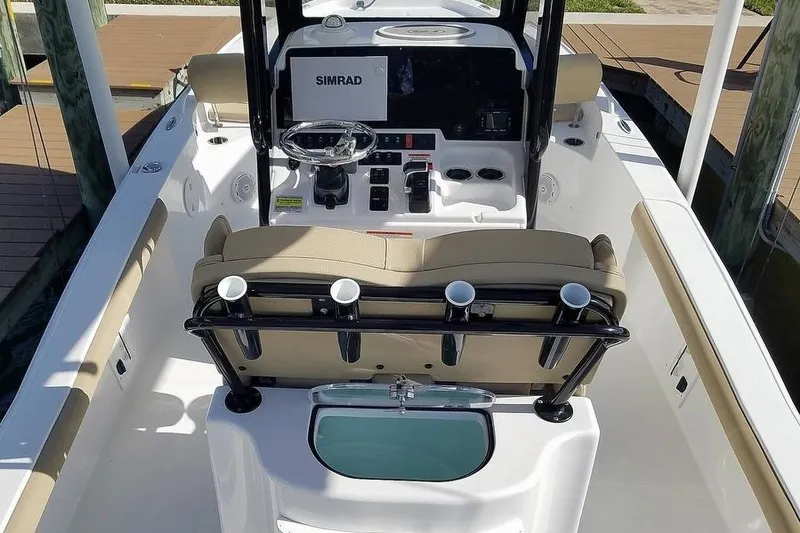 Slide: The Image of 2019 Sea Hunt BX 25 FS boat interior with steering console and seating. - 3