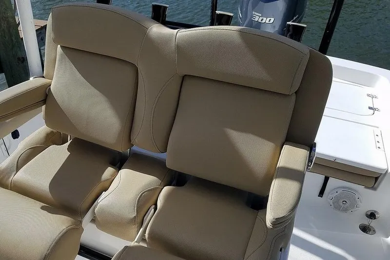 Slide: The Image of 2019 Sea Hunt BX 25 FS boat with beige cushioned seating and Yamaha 300 engine. - 4