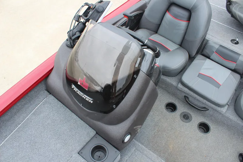 Slide: The Image of 2023 Tracker Pro Team 175 TXW boat interior with seating and console. - 13