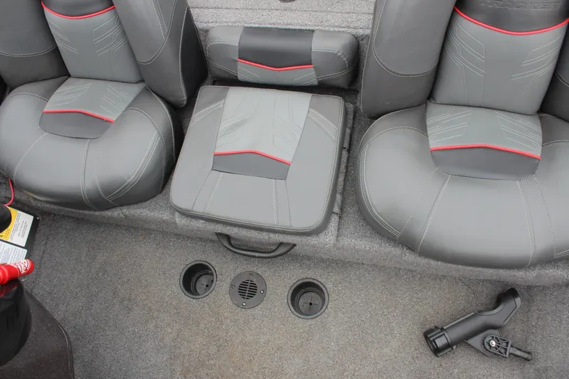 Slide: The Image of 2023 Tracker Pro Team 175 TXW boat interior with gray and red seating. - 14