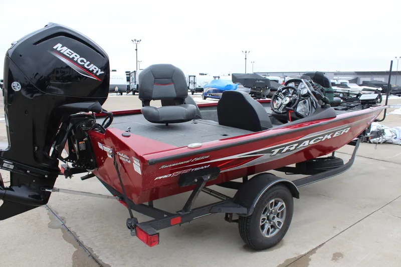 Slide: The Image of 2023 Tracker Pro Team 175 TXW boat with Mercury engine, parked on a trailer. - 7