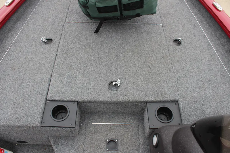 Slide: The Image of 2023 Tracker Pro Team 175 TXW boat deck with carpeted surface and storage compartments. - 9