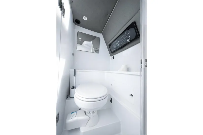 Slide: The Image of 2022 Axopar 37 XC Cross Cabin bathroom interior with modern fixtures and sleek design. - 17