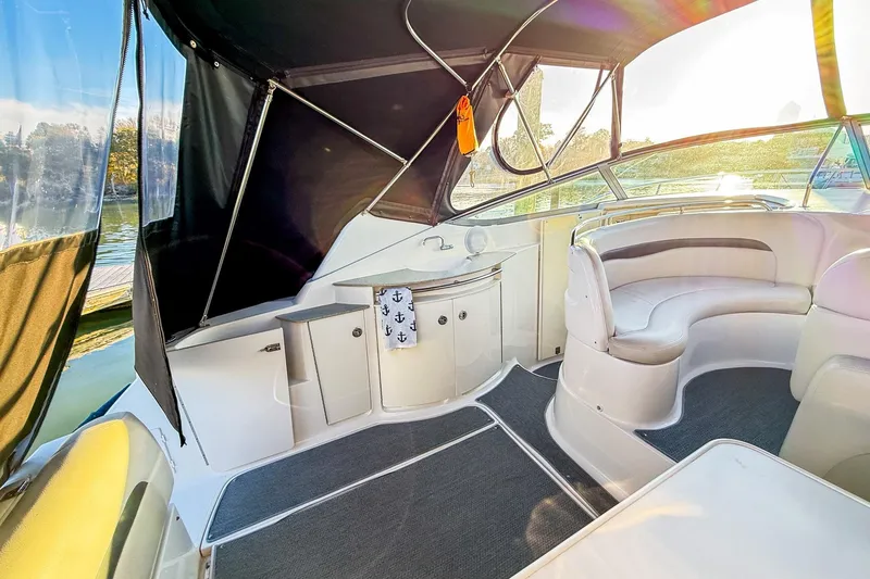 Slide: The Image of 2004 Chaparral Signature 350 boat interior with seating and sunlit view. - 12