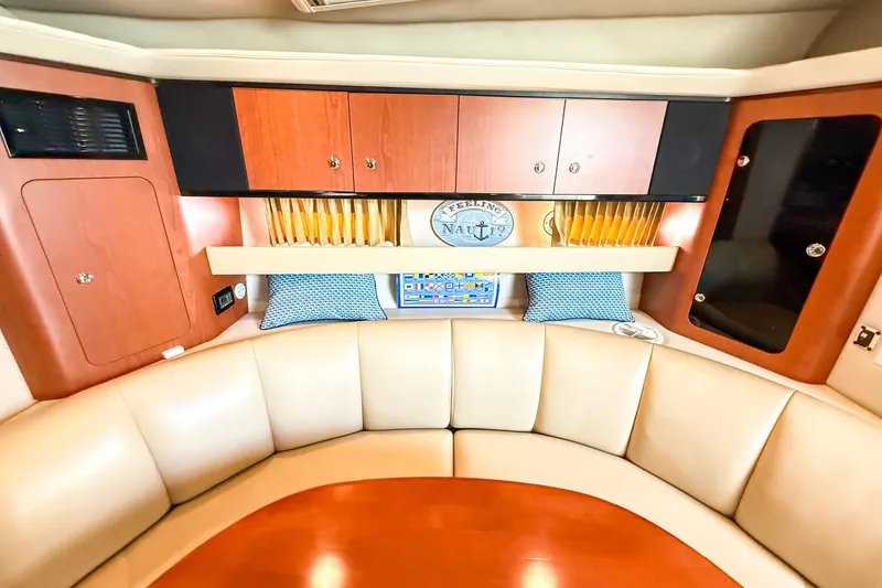 Slide: The Image of Interior of 2004 Chaparral Signature 350 yacht with cozy seating and wooden cabinetry. - 22