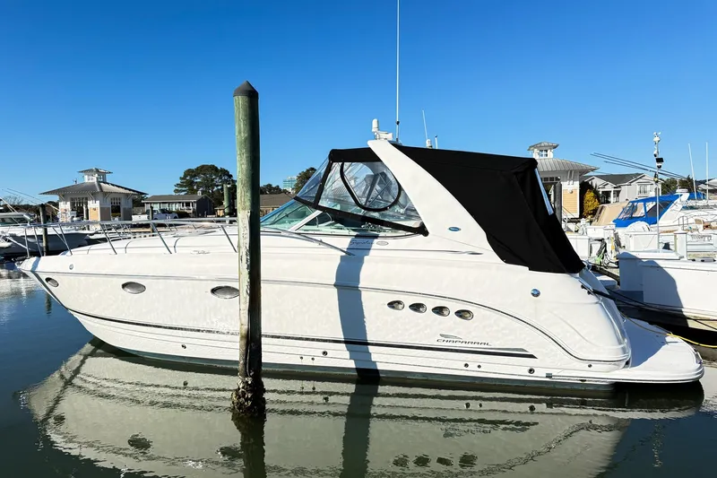 Slide: The Image of 2004 Chaparral Signature 350 boat docked in marina under clear blue sky. - 3