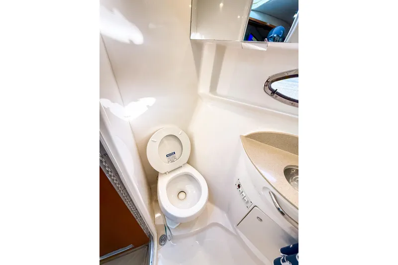 Slide: The Image of 2004 Chaparral Signature 350 boat bathroom with toilet and sink. - 30