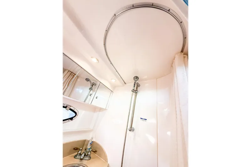 Slide: The Image of 2004 Chaparral Signature 350 bathroom with shower, mirror, and sink. - 31