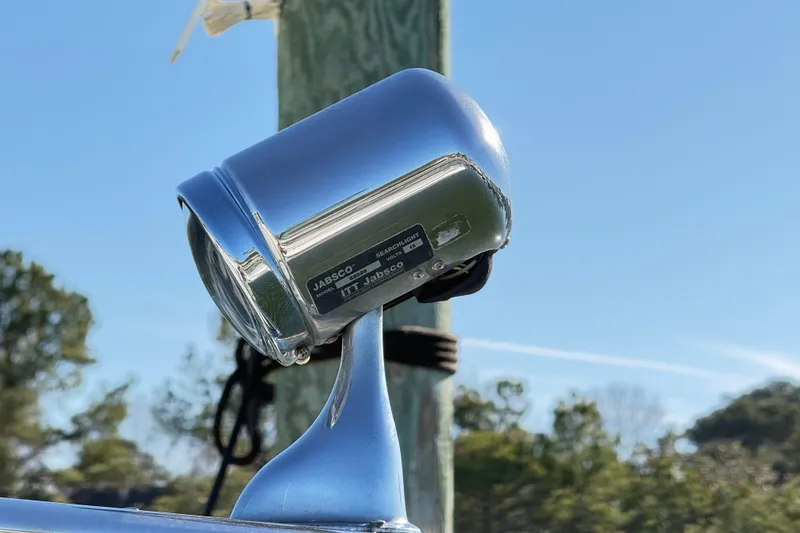 Slide: The Image of Chrome searchlight on 2004 Chaparral Signature 350 boat, clear sky background. - 35