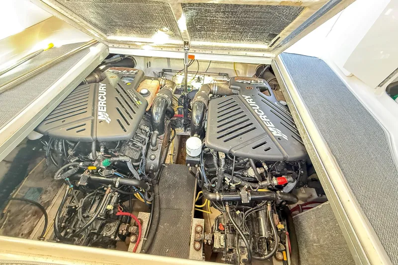 Slide: The Image of Engine compartment of 2004 Chaparral Signature 350 with dual Mercury engines. - 38