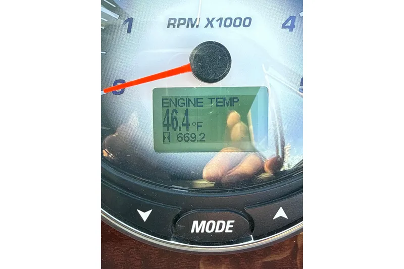 Slide: The Image of Close-up of Chaparral Signature 350 gauge showing engine temperature at 46.4°F. - 39