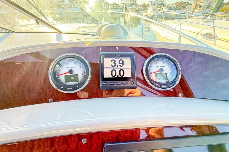 Slide: The Image of Dashboard of 2004 Chaparral Signature 350 boat with gauges and GPS display. - 41