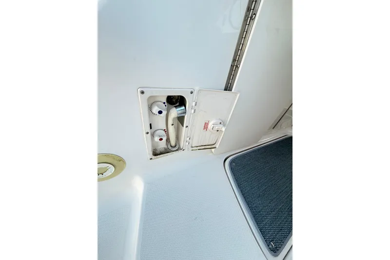 Slide: The Image of 2004 Chaparral Signature 350 boat shower controls and compartment. - 45