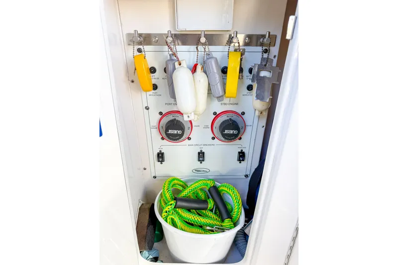 Slide: The Image of Electrical panel and equipment storage on 2004 Chaparral Signature 350 boat. - 46