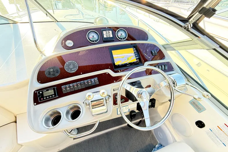 Slide: The Image of Cockpit of 2004 Chaparral Signature 350 with steering wheel and navigation controls. - 5