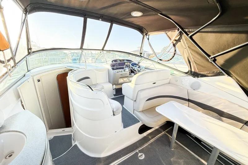 Slide: The Image of 2004 Chaparral Signature 350 boat interior with seating and helm, featuring modern design. - 8