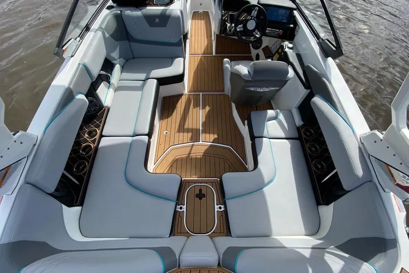 Slide: The Image of 2020 Nautique Super Air Nautique GS20 interior with luxurious seating and modern dashboard. - 4