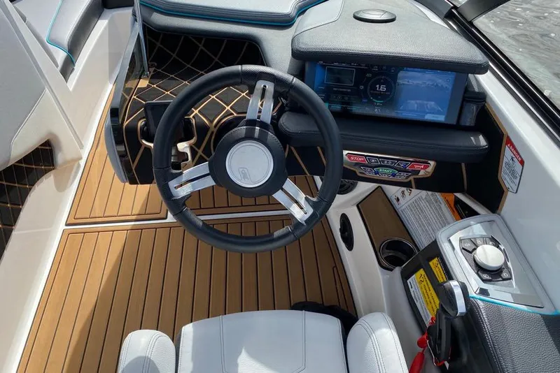 Slide: The Image of 2020 Nautique Super Air Nautique GS20 boat cockpit with modern steering and controls. - 5