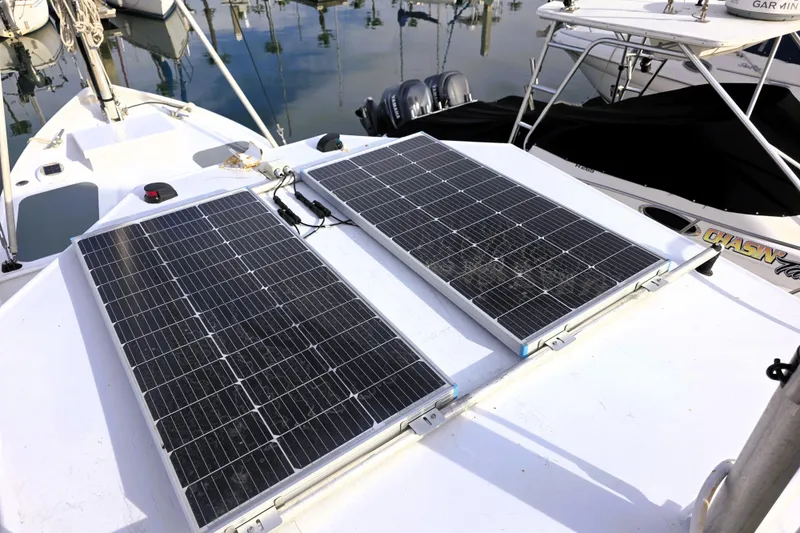 Slide: The Image of Solar panels on 2016 Custom 25 Tug boat deck in marina setting. - 13