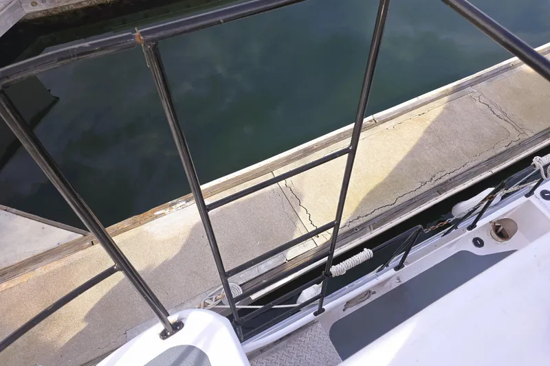 Slide: The Image of View from a 2016 Custom 25 Tug boat docked at a marina. - 16