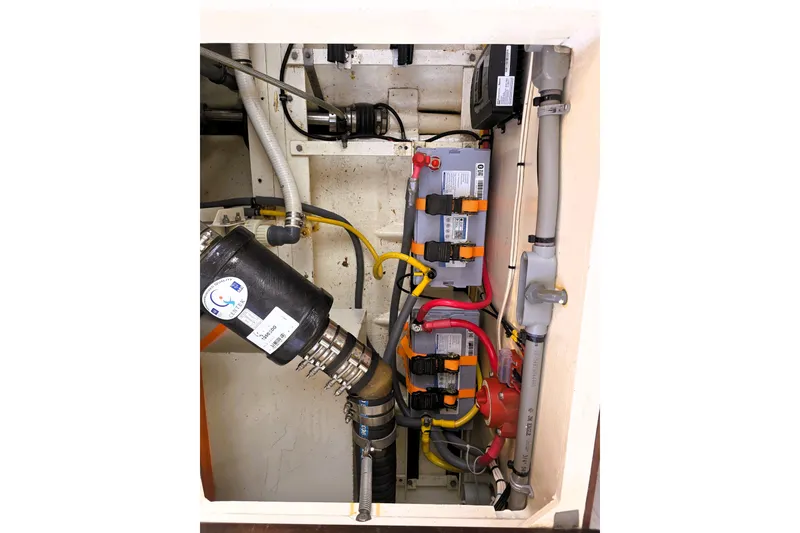 Slide: The Image of Engine compartment of a 2016 Custom 25 Tug, showcasing wiring and components. - 35