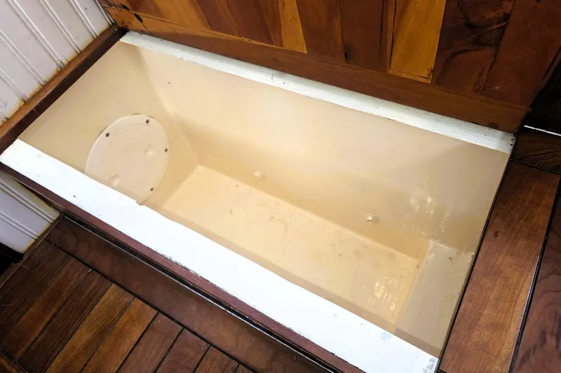Slide: The Image of Storage compartment in 2016 Custom 25 Tug boat with wooden flooring. - 38