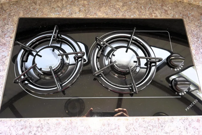 Slide: The Image of Two-burner black stovetop on a 2016 Custom 25 Tug boat. - 41