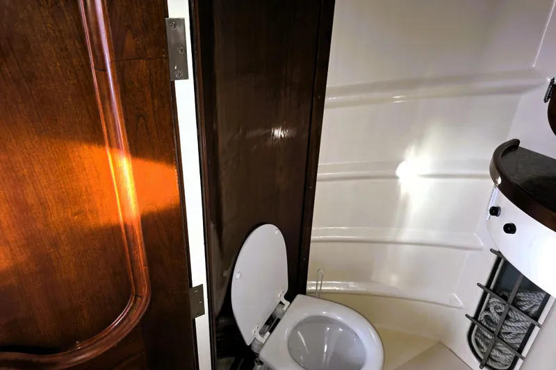 Slide: The Image of Interior of 2016 Custom 25 Tug boat bathroom with wooden door and compact toilet. - 50
