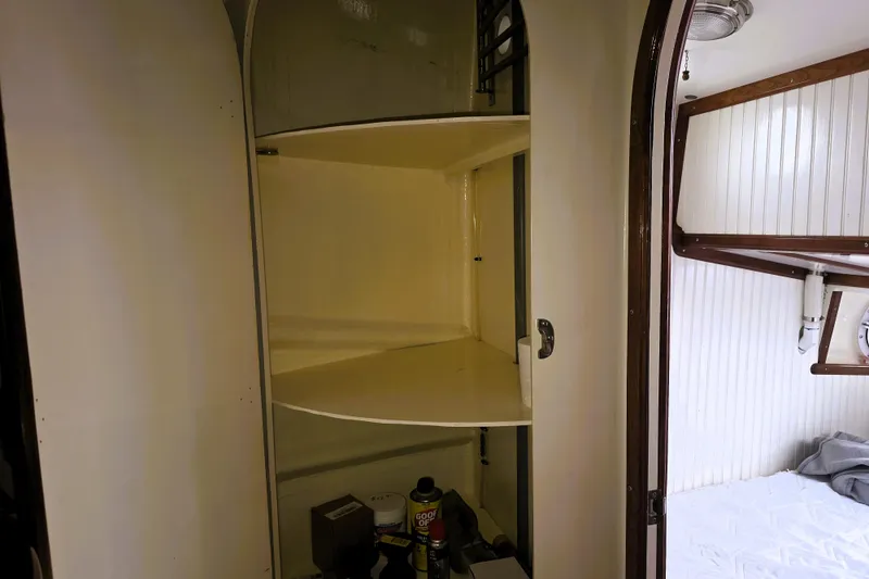Slide: The Image of Interior of 2016 Custom 25 Tug showing storage shelves and cabin details. - 52