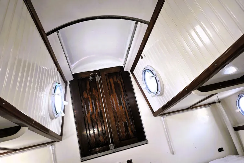 Slide: The Image of Interior of 2016 Custom 25 Tug boat with wooden doors and porthole windows. - 55