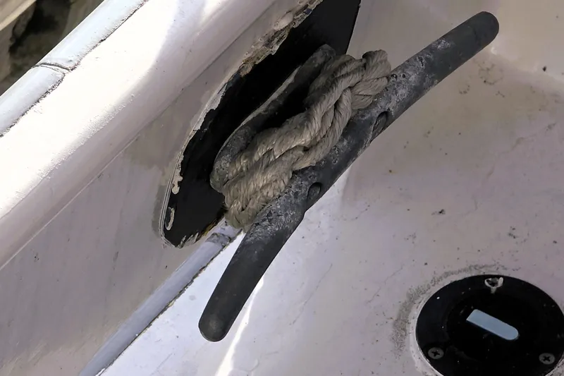Slide: The Image of Close-up of a rope tied to a cleat on a 2016 Custom 25 Tug boat. - 56