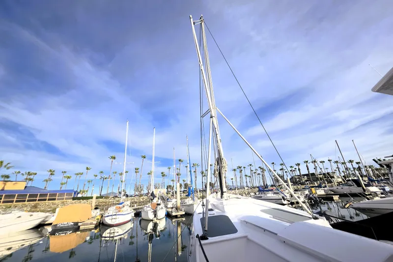 Slide: The Image of Boats docked in a marina under a clear blue sky, Custom 25 Tug, 2016. - 58